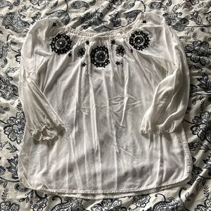 White top with black design